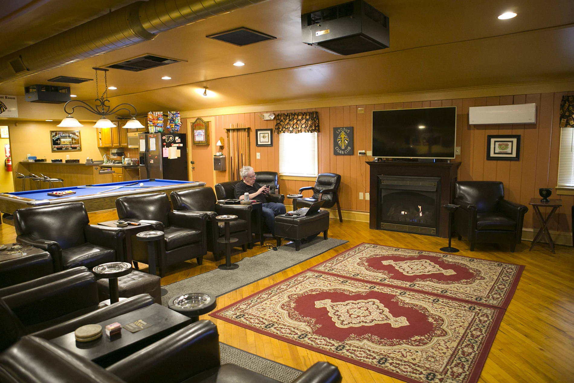 Fireplace seating and television in the main Exodus lounge
