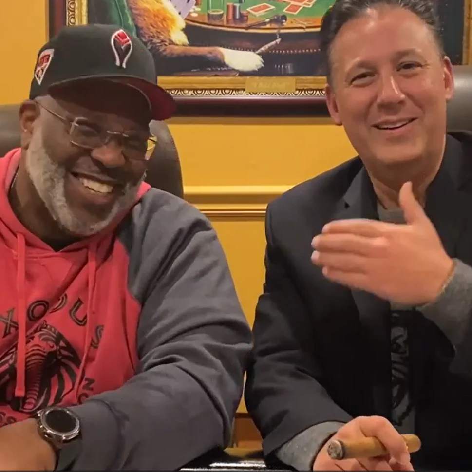Two Exodus members laughing together in the poker room